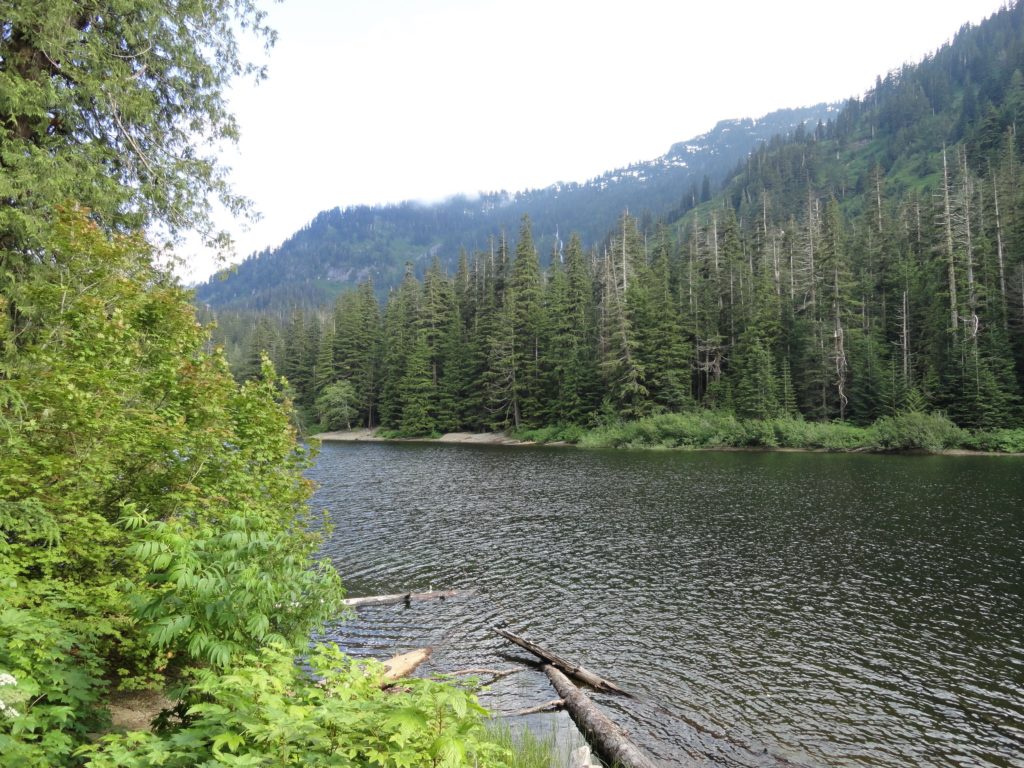 Barclay Lake–placid lake at the base of awe-inspiring Baring Mountain ...